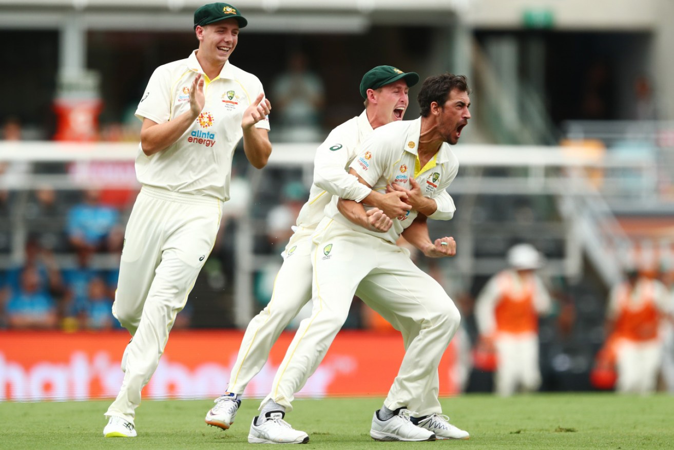 Australia celebrates Mitchell Starc's first-ball strike on Wednesday.