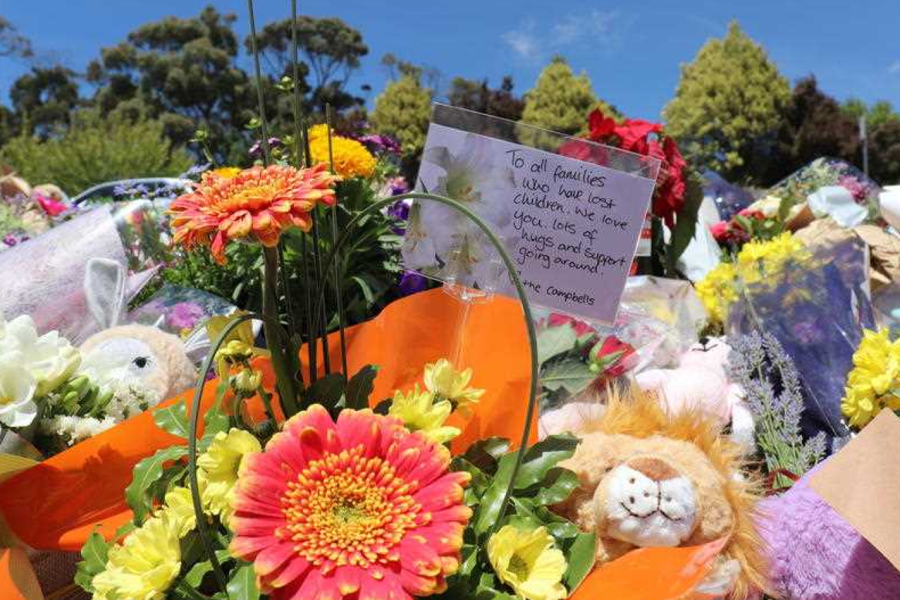 A mountain of flowers and heartfelt notes continues to grow outside the school.