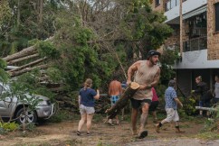 Woman killed by fallen tree as storm hits Sydney