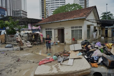 Malaysian floods displace 21,000 people as month’s rain falls in a day