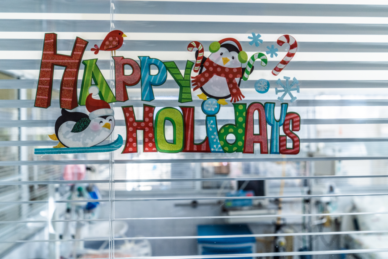 Sign of the times: The irony of a cheerful Christmas greeting on the window of an ICU unit. 
