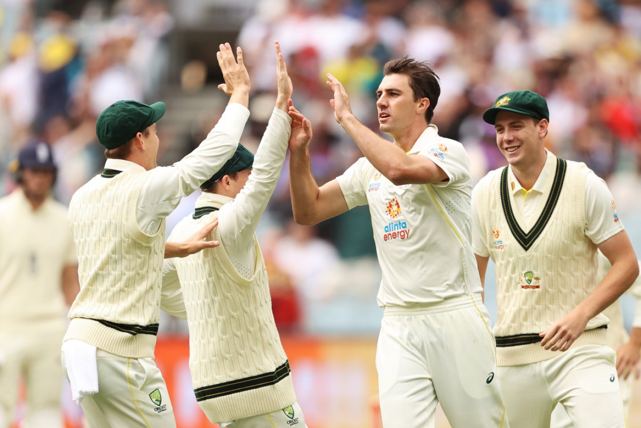 Pat Cummins celebrates the dismissal of Haseeb Hameed on Sunday. 