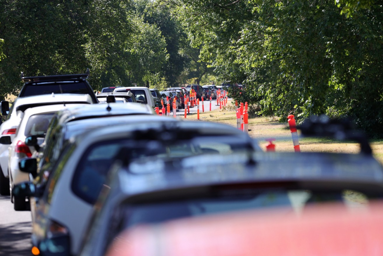 Large queues at a drive-through testing site at Albert Park in Melbourne.