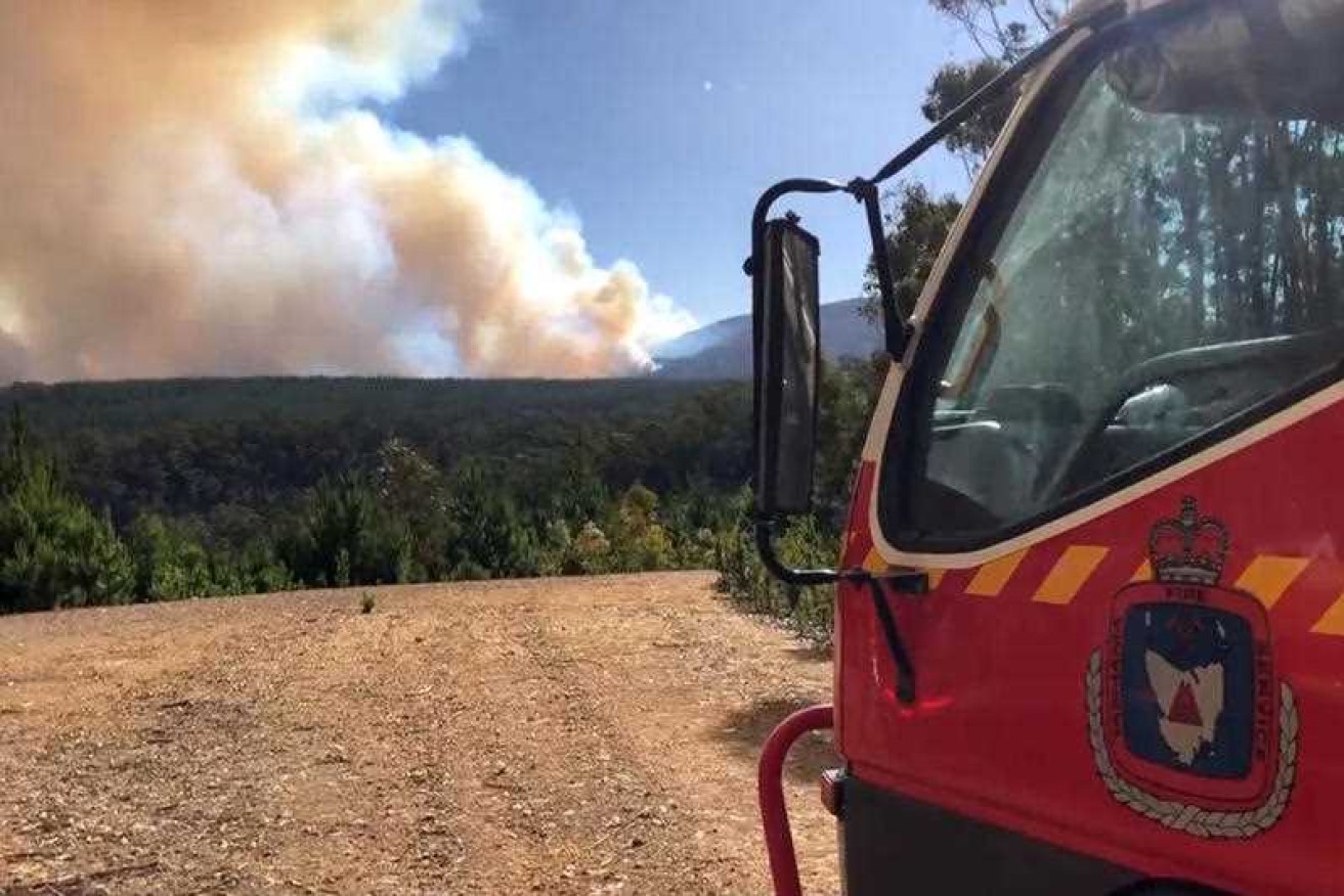 A Tasmanian volunteer firefighter has been charged, accused of starting six fires on Flinders Island across two years.