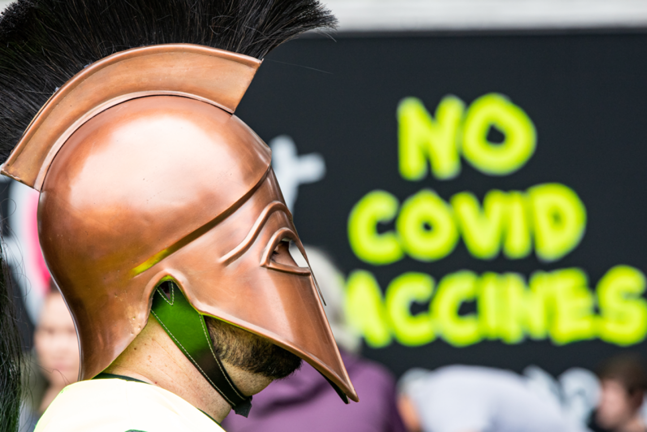 Despite skyrocketing COVID cases anti-vaxxers, including this gent in his Spartan helmet, turned out to denounce jab mandates.