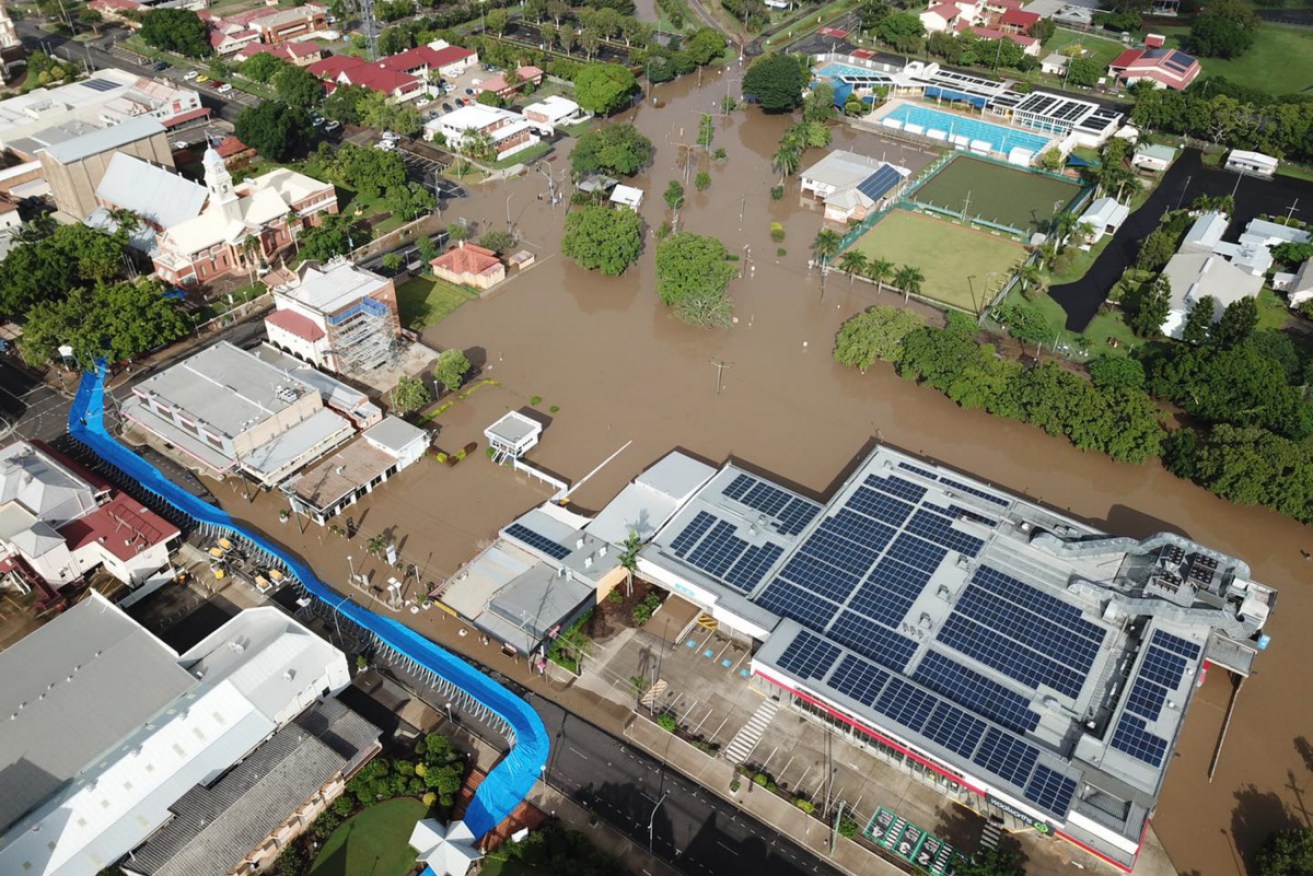 Floodwaters surged into Maryborough's CBD when a valve on the city's levee bank broke .