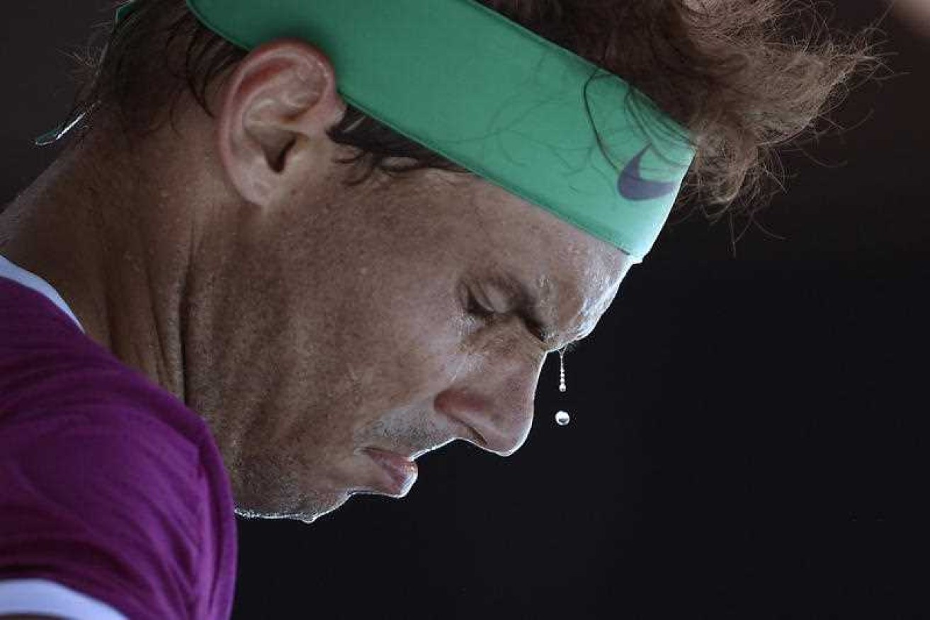 Rafael Nadal is fighting back against German Yannick Hanfmann in his second round clash.
