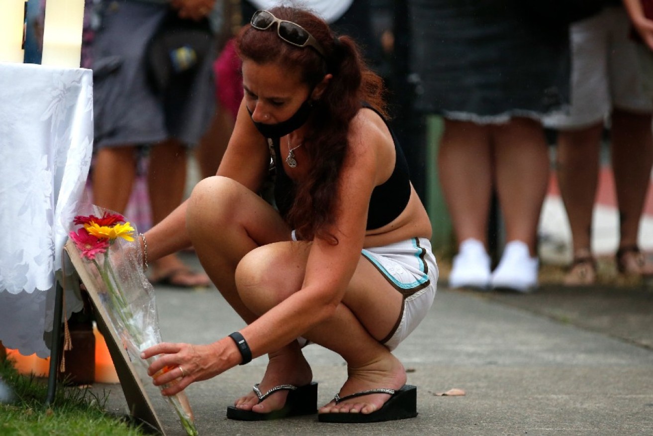 About 150 people gathered for a vigil outside the girl’s Tweed Heads school.