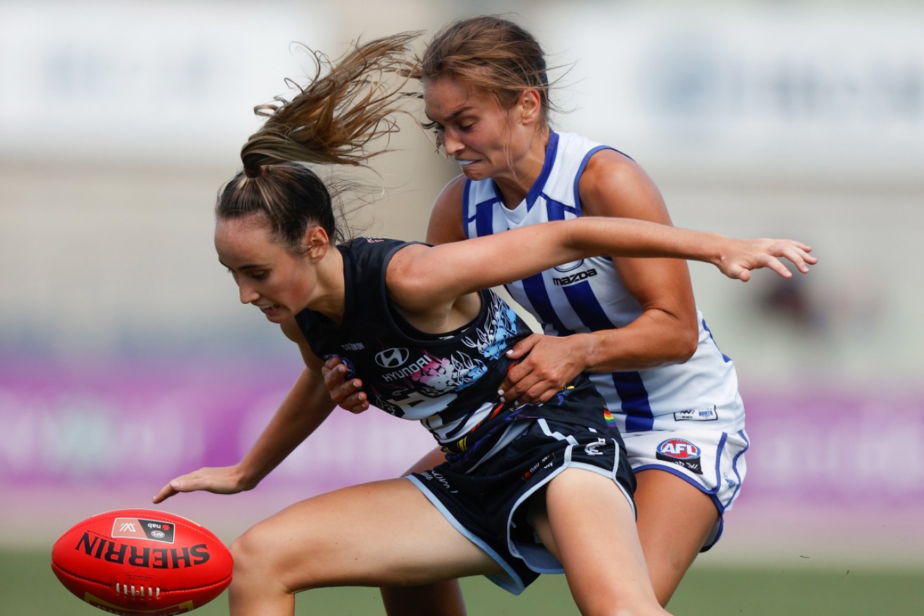 Carlton's Georgia Gee is shadowed by North's Ashleigh Riddell at Ikon Park on Sunday.