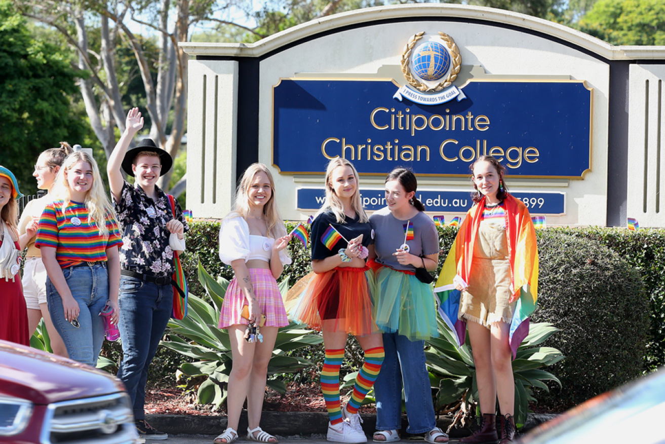 Former students of the Citipointe Christian College protest outside the Brisbane private school earlier this week.