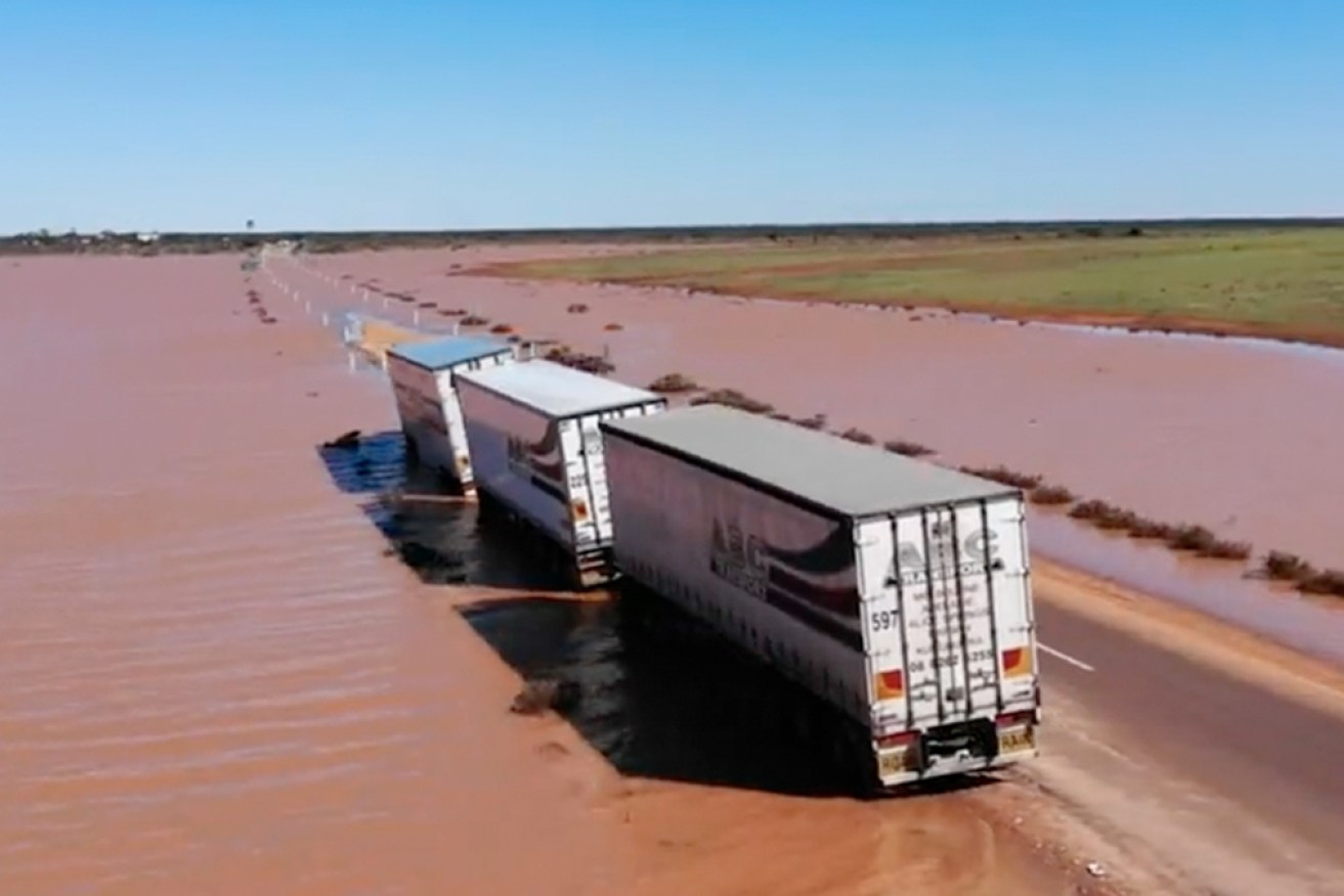 The Stuart Highway, the crucial link between Adelaide and Darwin, has reopened to some trucks.