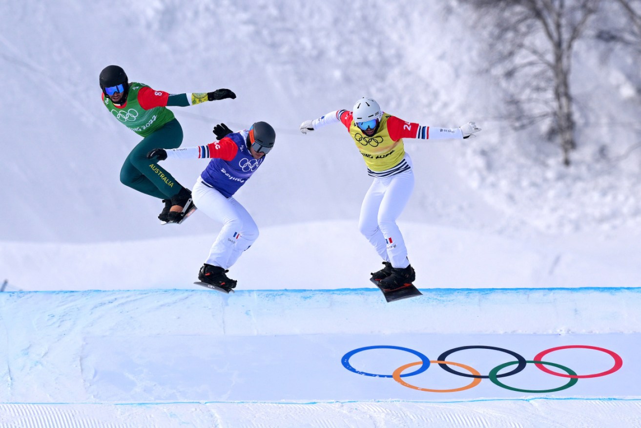 Australian Cameron Bolton (left) competes in Thursday's snowboard cross quarter-finals. 