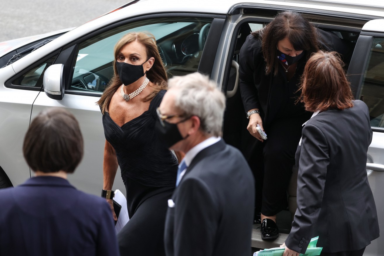 Anne Peacock arrives for her father Andrew's memorial service in Melbourne on Friday.