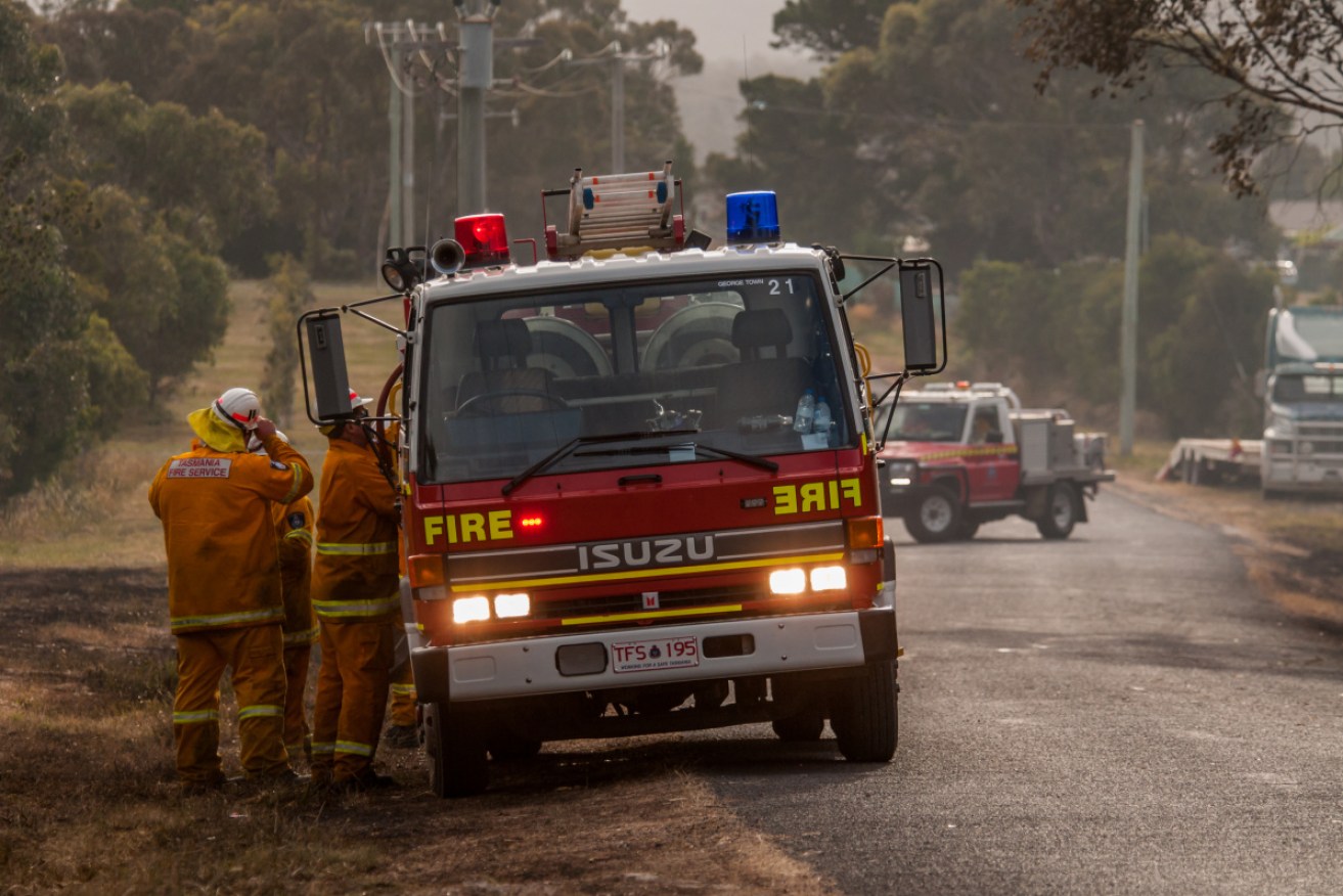 Emergency services responded to reports a helicopter crashed fighting a Tasmania bushfire.