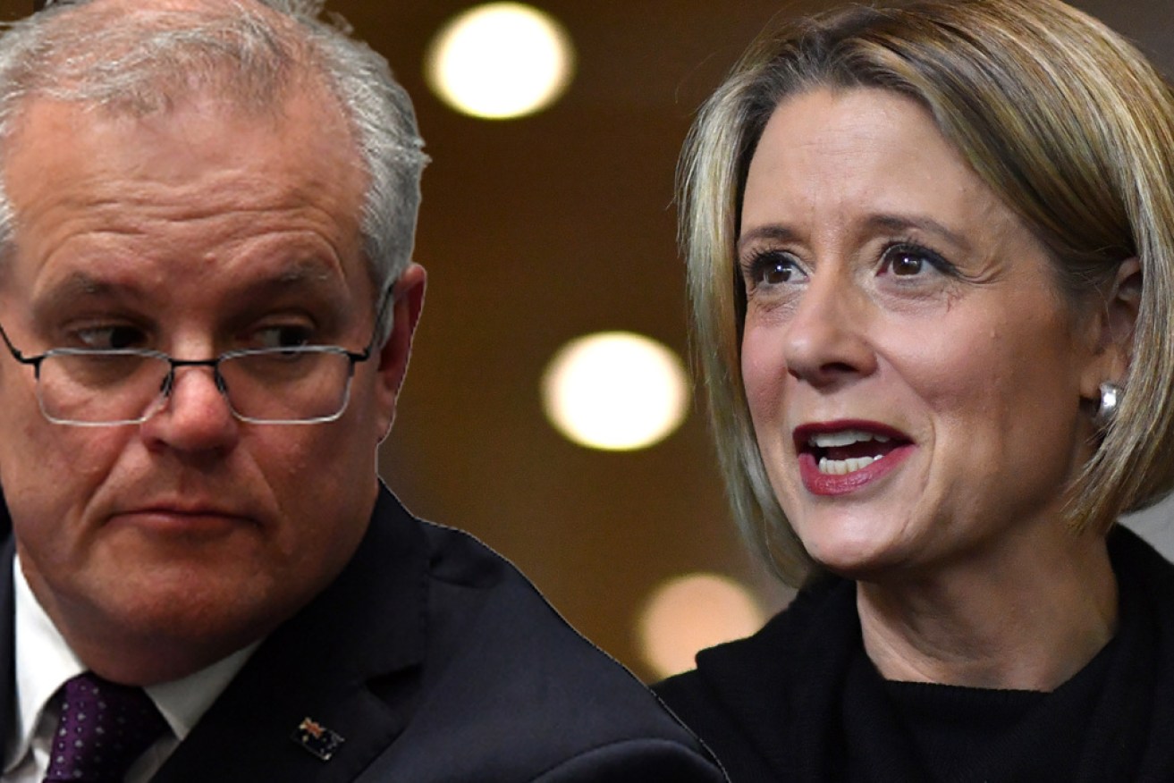 Scott Morrison has accused Labor's Kristina Keneally of backing domestic abuse perpetrators.