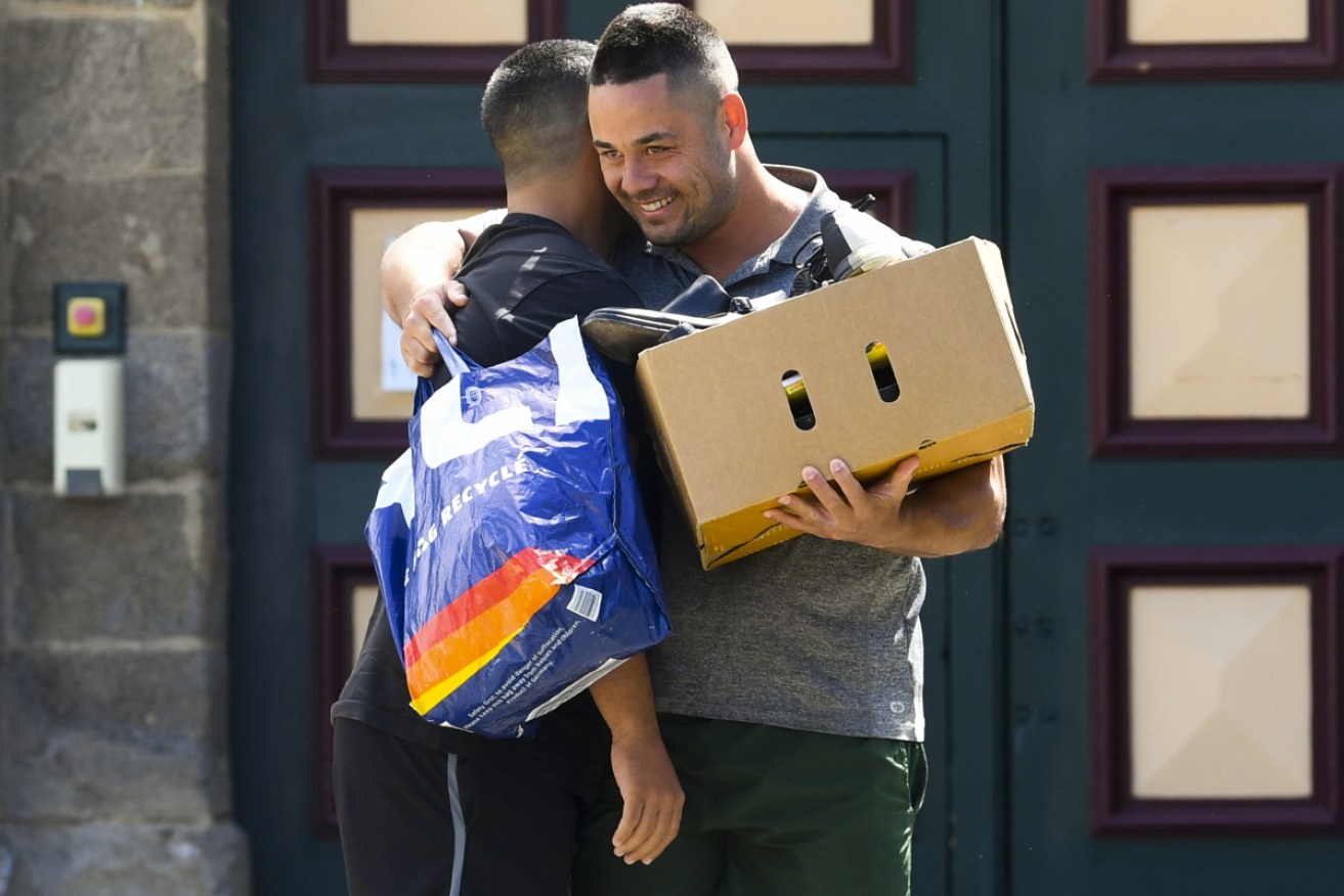 Jarryd Hayne greets a friend as he emerges from Cooma Correctional Centre on Tuesday afternoon.