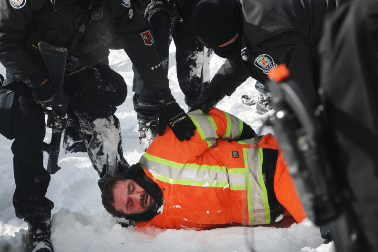 After three weeks of Ottawa being brought to a standstill, police finally start clearing the streets.<i>Photo: Getty</i>