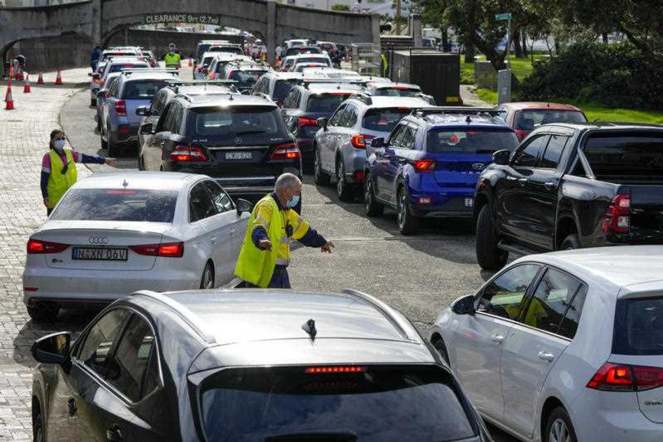There are 4916 new cases of COVID-19 in NSW and seven more deaths as the country's borders reopen in a boost for the battered tourism industry.