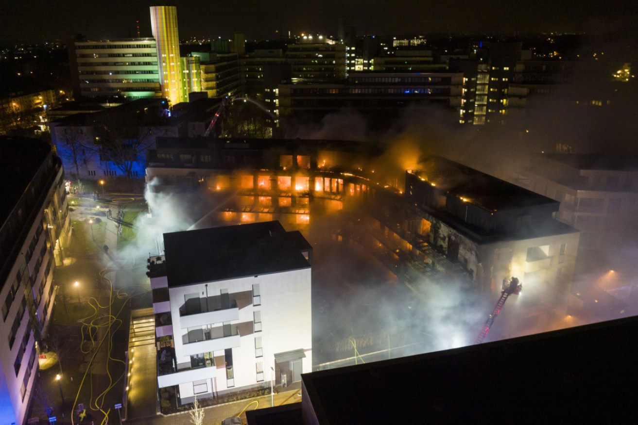A fire whipped up by high winds has raged through an apartment complex in western Germany.