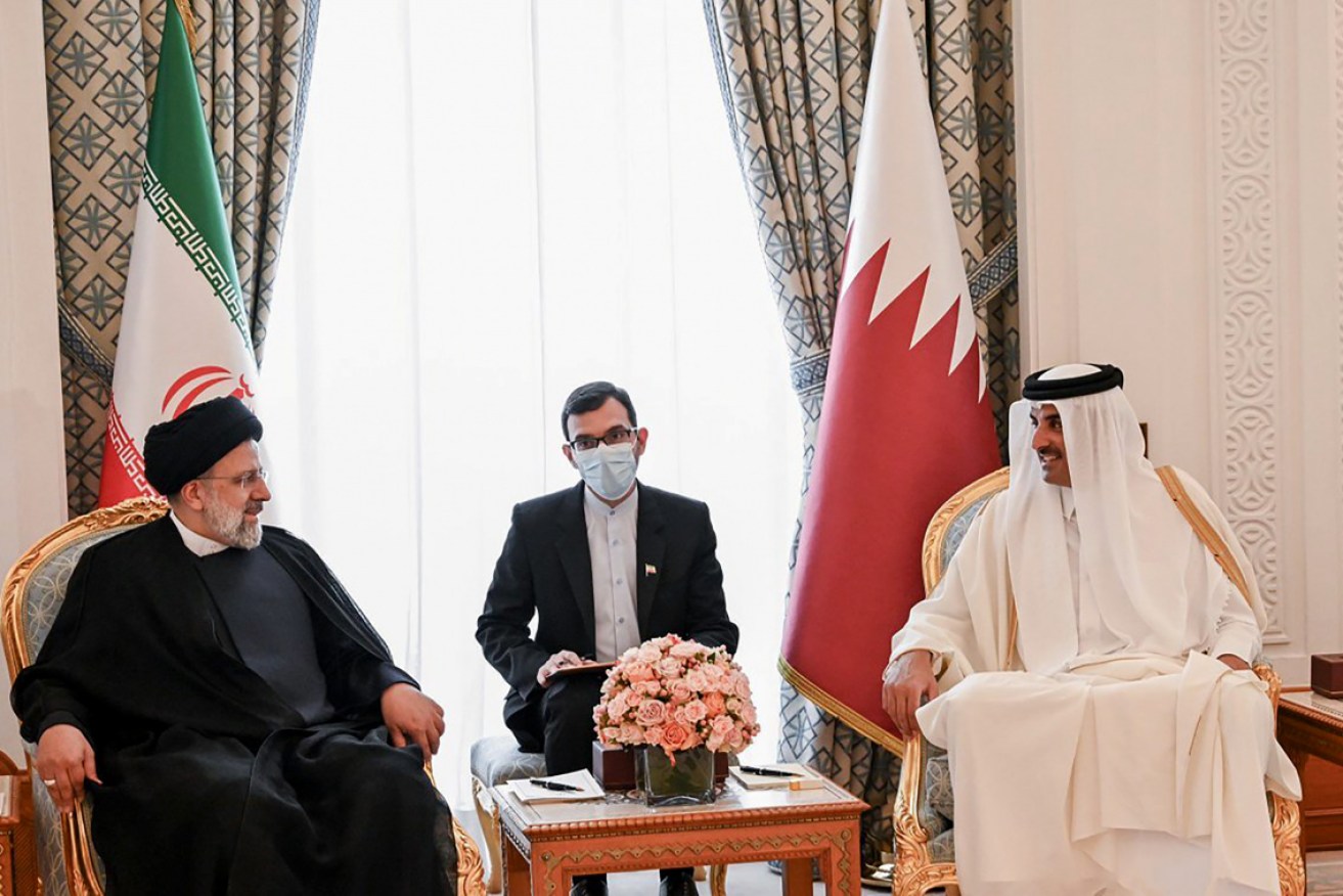 Iranian President Ebrahim Raisi (left) says the US must be prepared to lift sanctions against Iran.