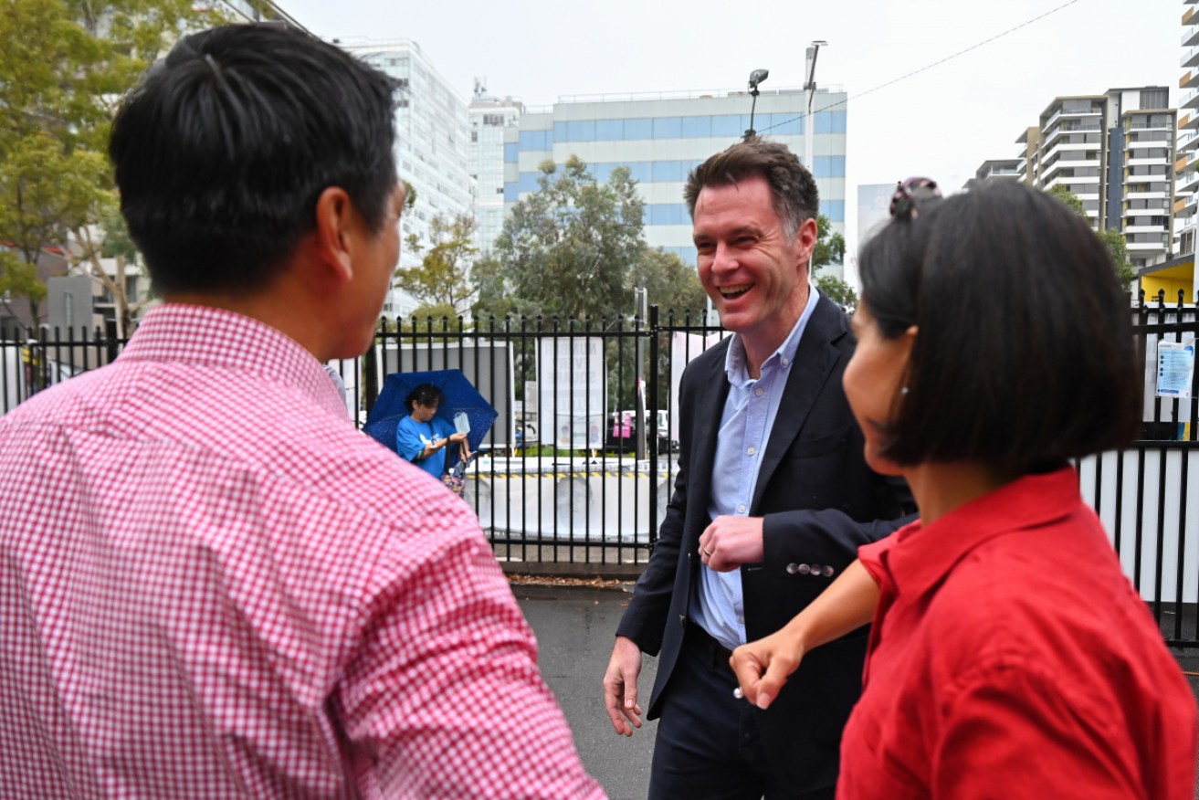 NSW Labor Leader Chris Minns (centre) is polling ahead of Dominic Perrottet as preferred premier.
