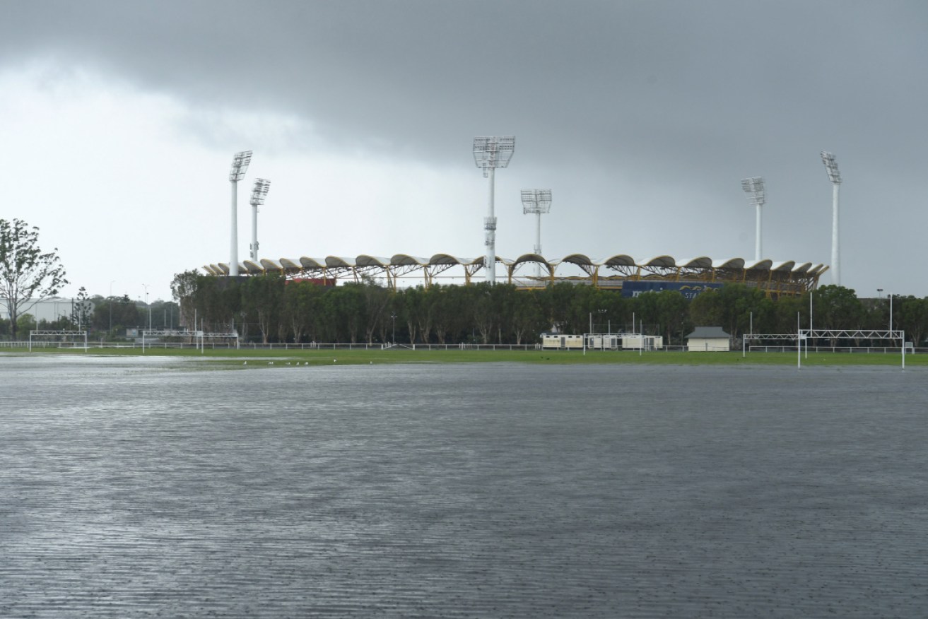 Floodwaters cover a football field at Carrara on the Gold Coast, with more rain on the way on Friday.