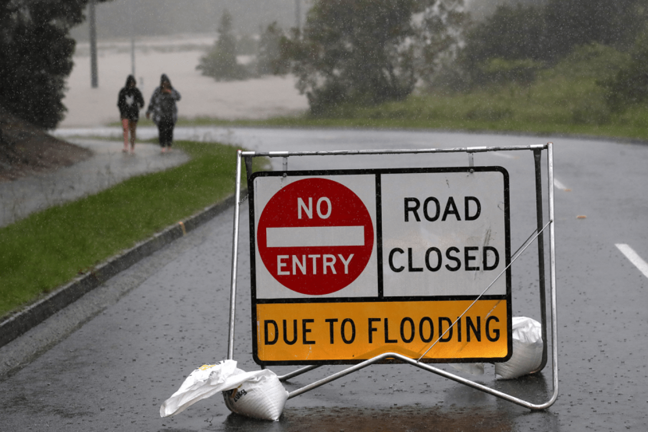Warning signs like this one at Logan are appearing all over Southeast Queensland.<i>Photo: AAP</i>