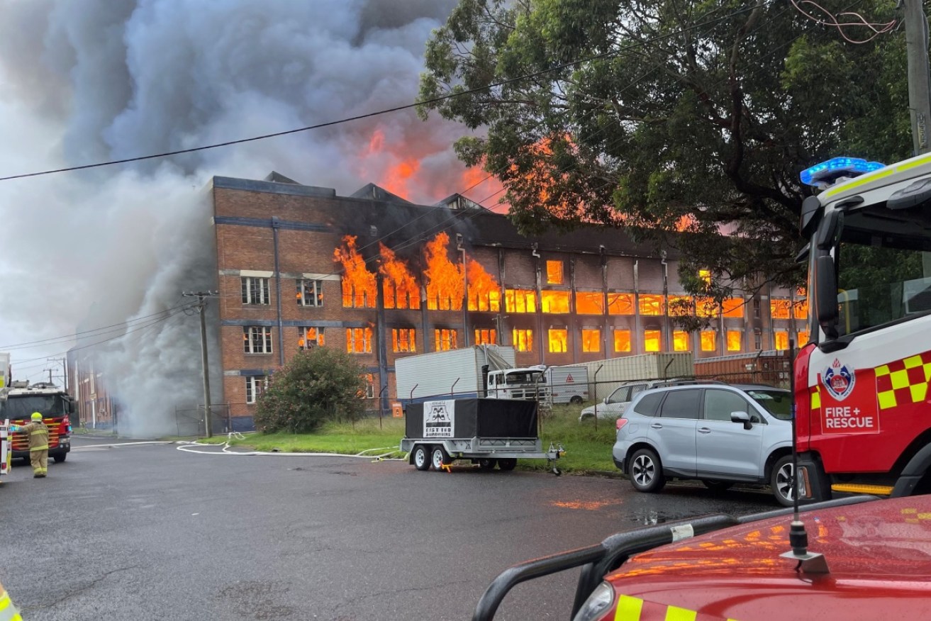 Firefighters have contained a blaze that broke out in a former wool store in inner Newcastle.