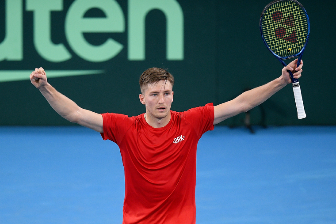 Mate Valkusz of Hungary celebrates after defeating Australia's John Peers and Luke Saville  with partner Fabian Marozsan in the Davis Cup Qualifier. <i>Photo: AAP<i></i>