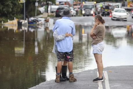 Flood toll rises as woman's body found in Qld 