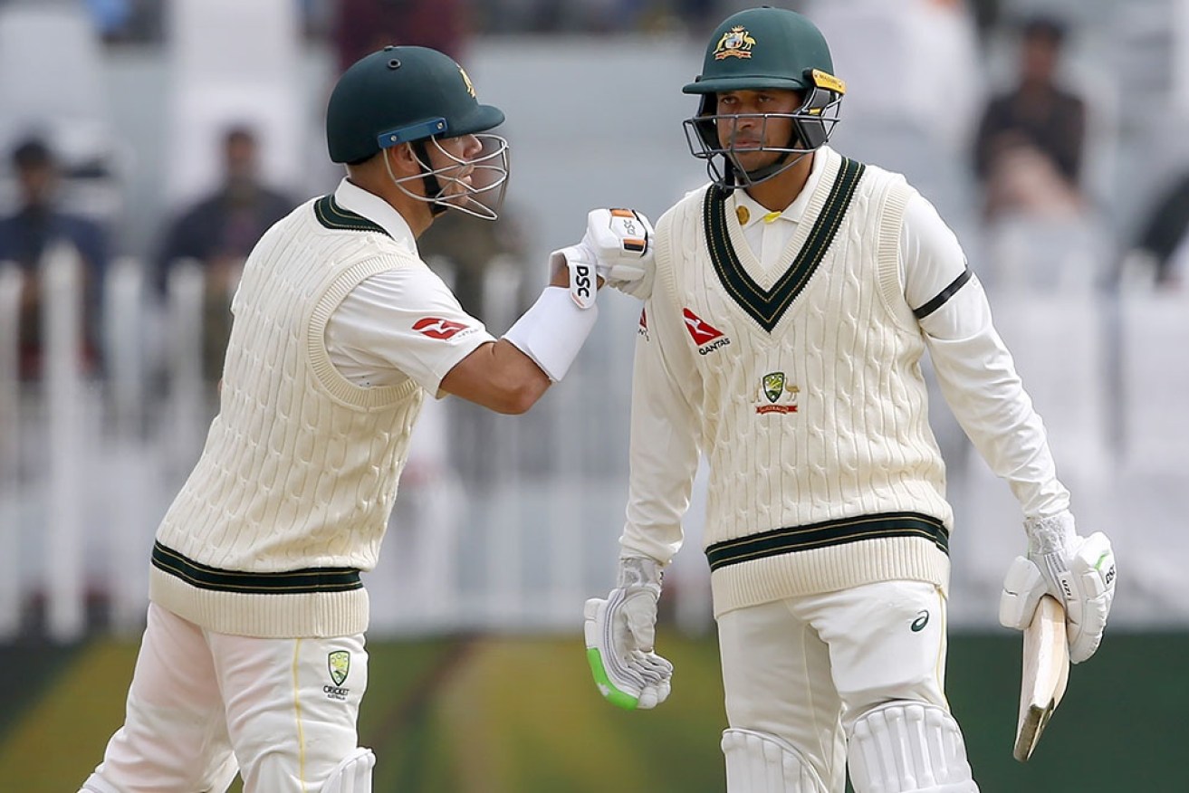 David Warner and Usman Khawaja set Australia on its way to a healthy reply to Pakistan's massive total.