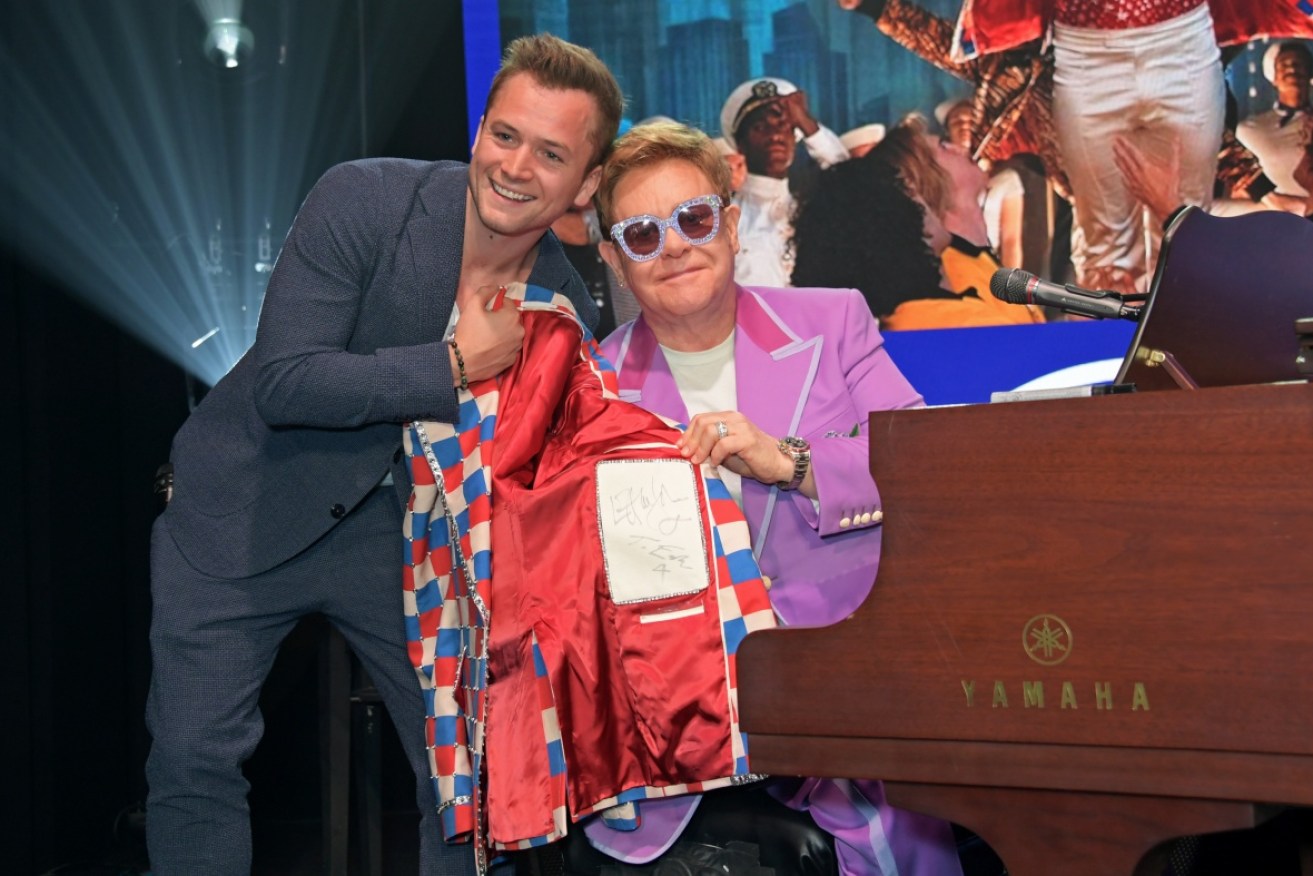 Egerton and Sir Elton John together in 2019.