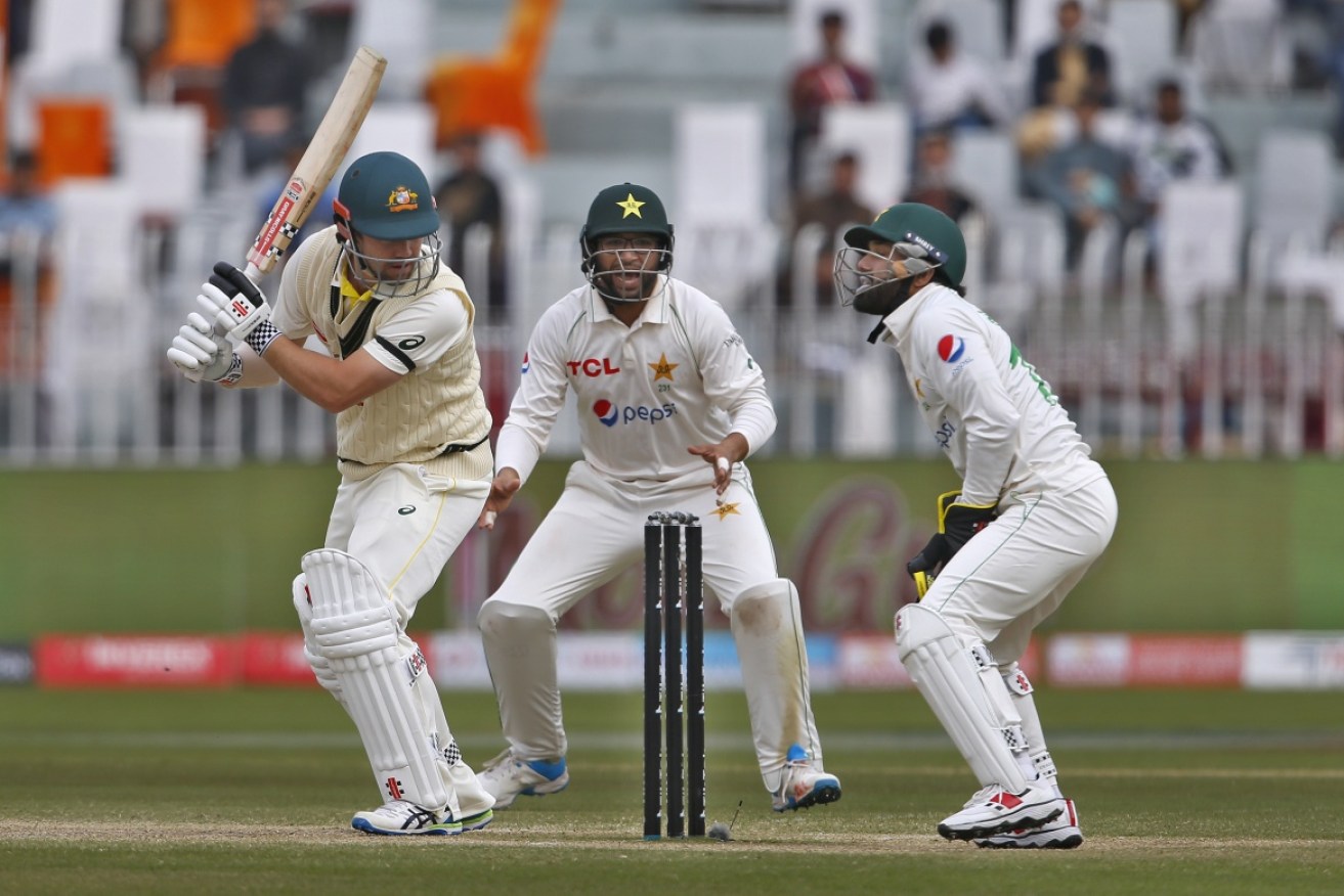 Pakistan wicketkeeper Mohammad Rizwan dismisses Australia's Travis Head on Monday.