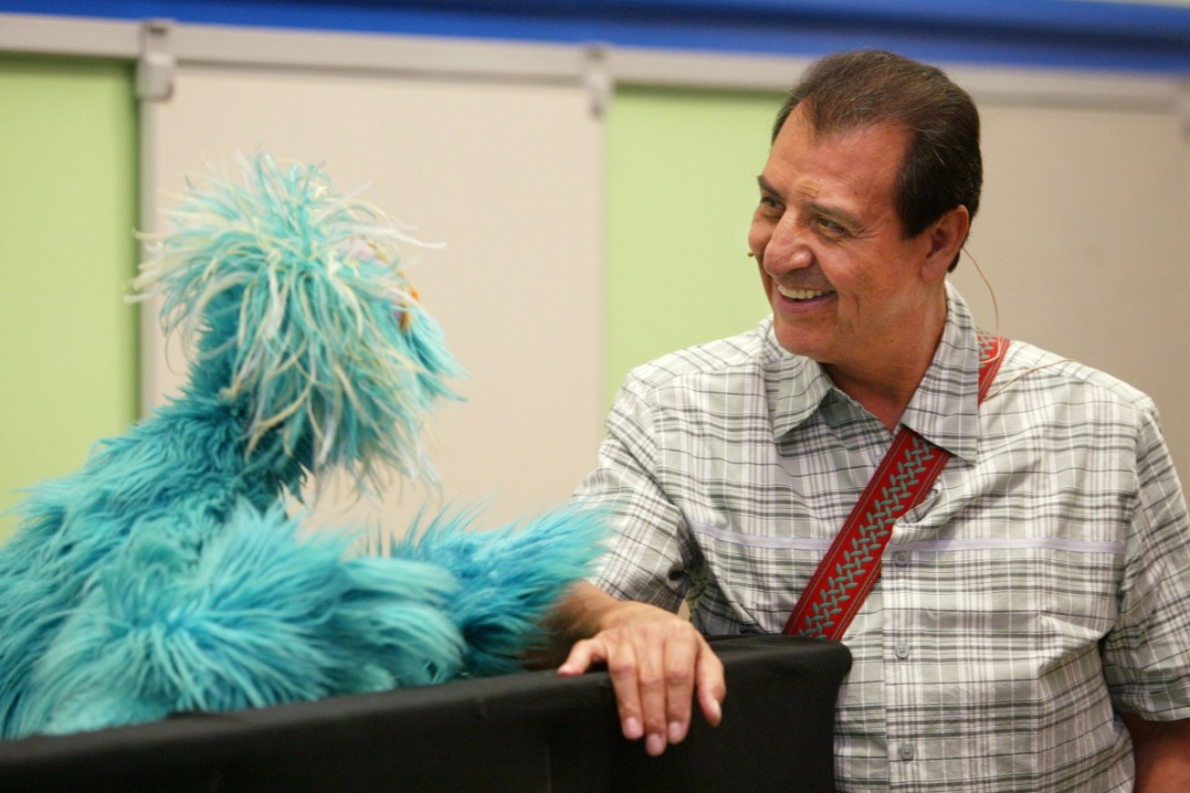 Emilio Delgado in conversation with Muppet Rosita.