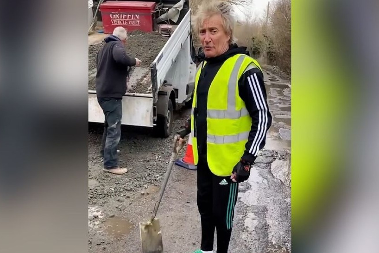 Rod Stewart was filmed filling monstrous potholes near his home in Harlow, England.