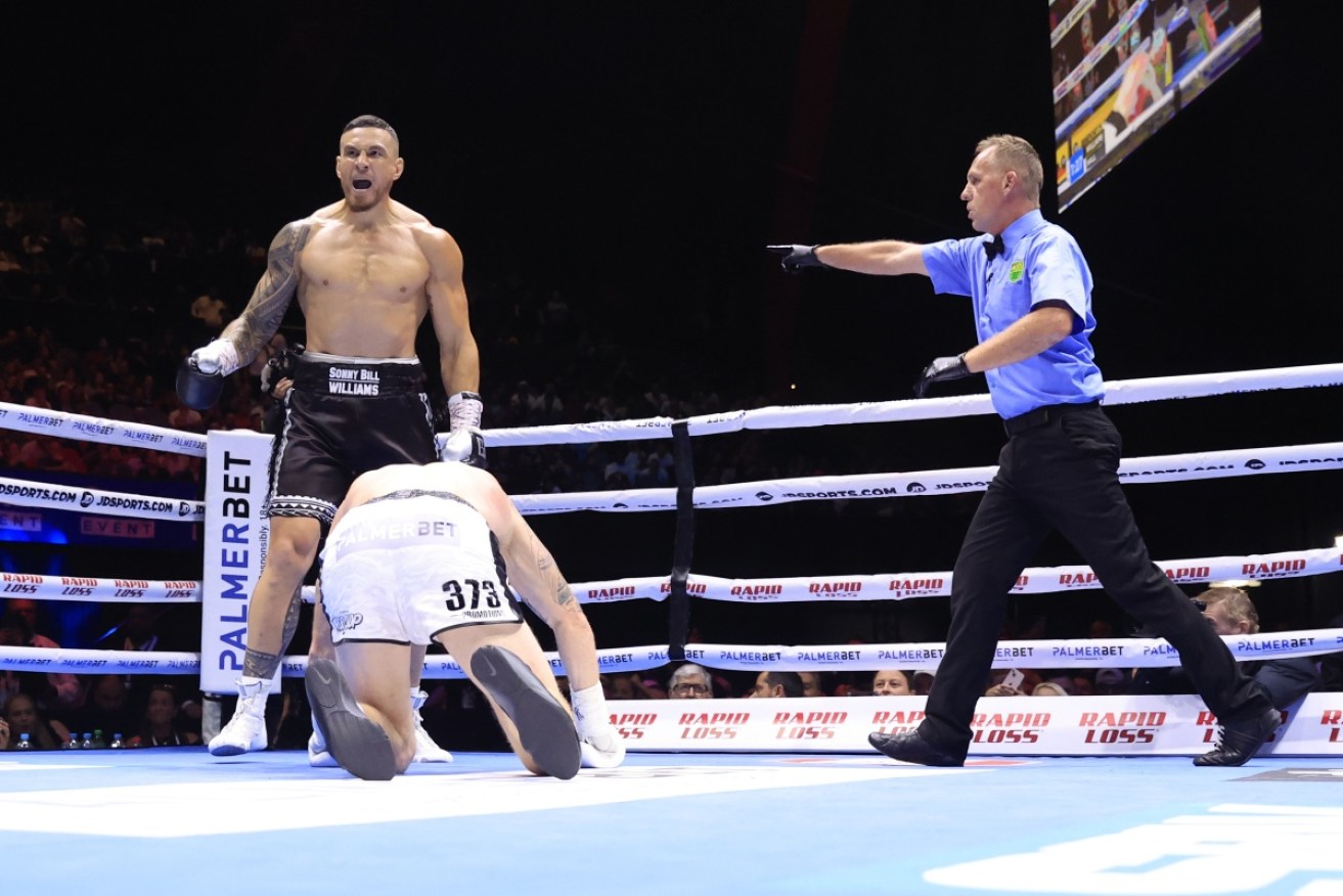 Sonny Bill Williams roars after knocking down Barry Hall in his one-round heavyweight win. 