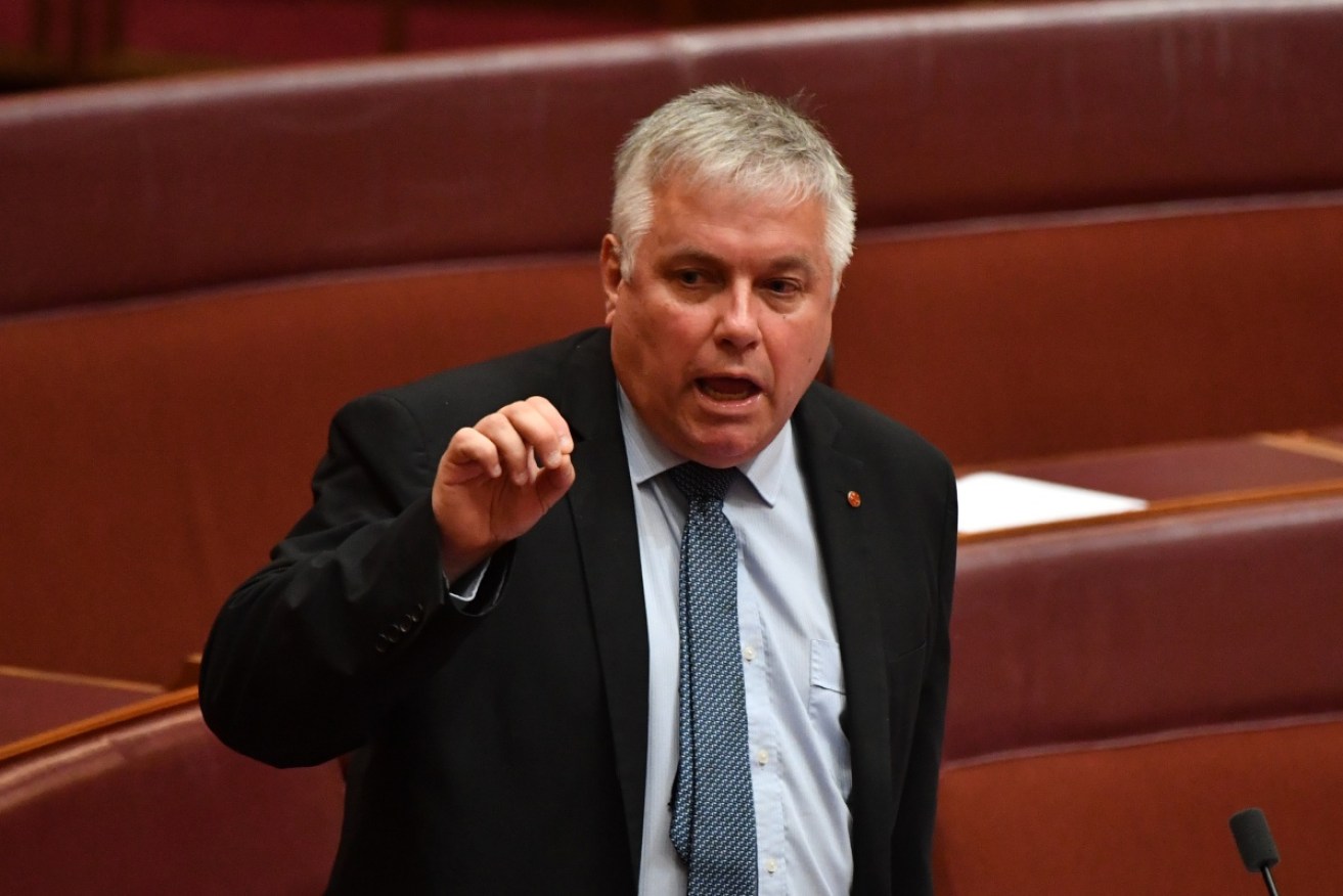 Senator Rex Patrick (right) has savaged challenger and former boss Nick Xenophon over his paid work for Huawei.