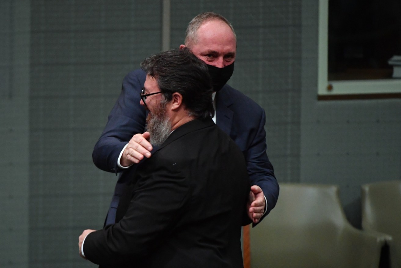 George Christensen is congratulated by Deputy PM Barnaby Joyce after his speech.
