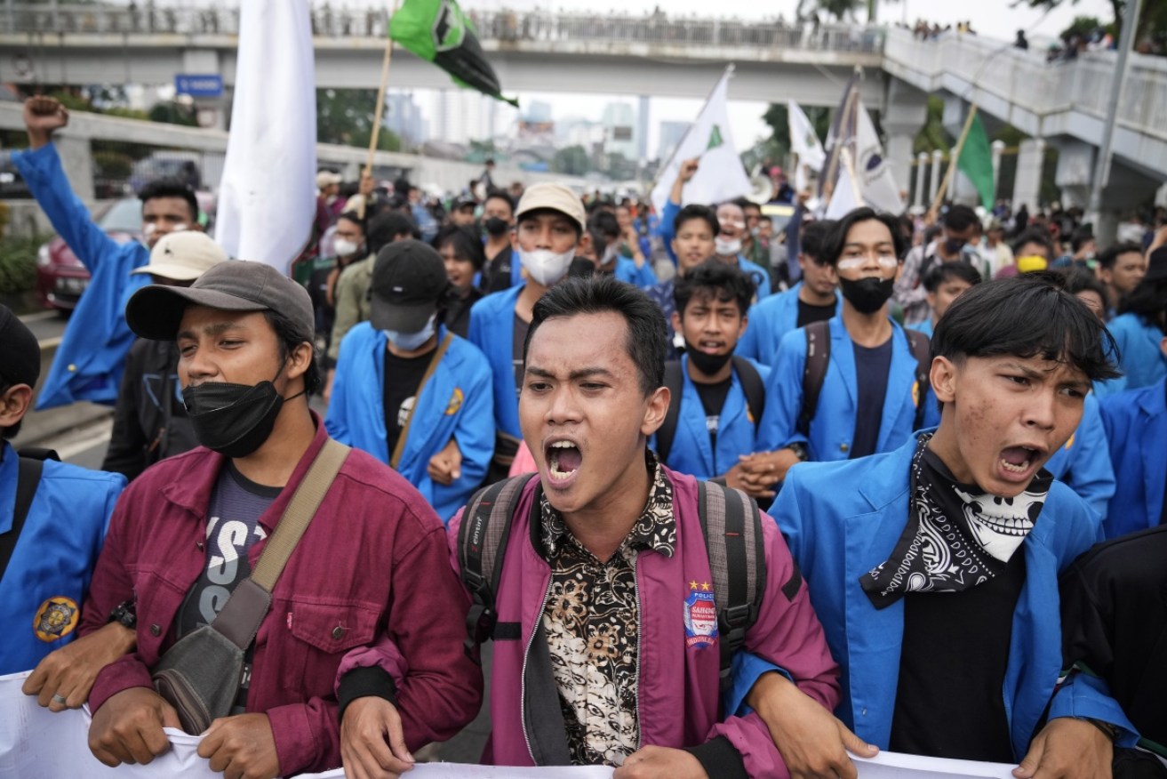 Hundreds of students wearing neon jackets marched towards parliament in Jakarta. 