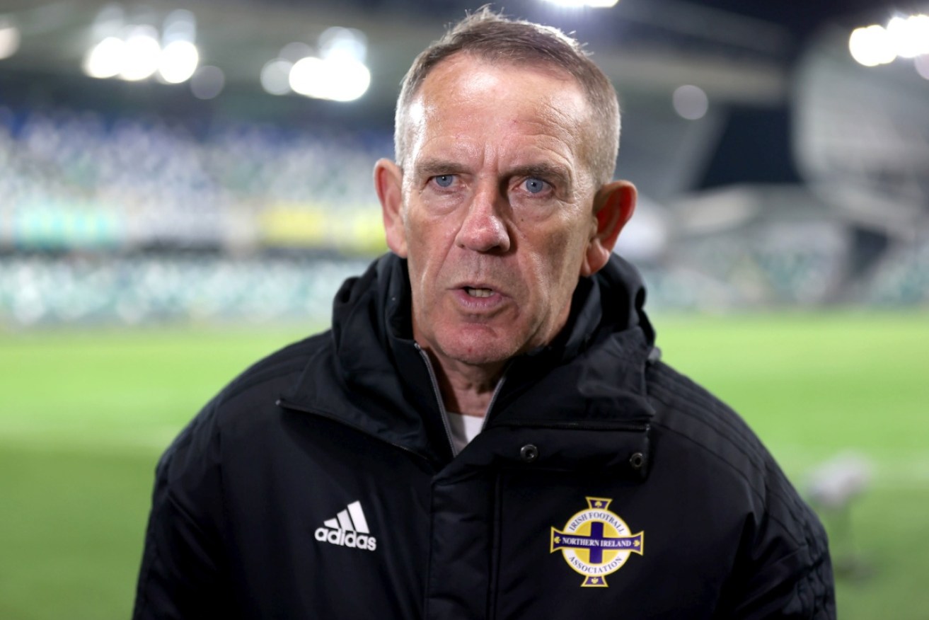 Northern Ireland manager Kenny Shiels apologizes for "women are more emotional" comment.