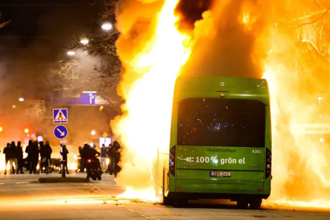 Flames light up the Malmo night as another vehicle burns amid clashes in a number of cities. 