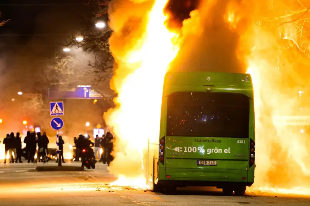 Flames light up the Malmo night as another vehicle burns amid clashes in a number of cities.