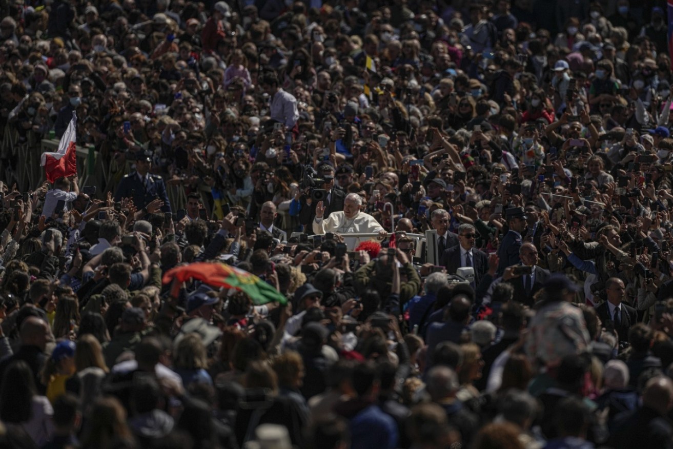 Pope Francis drives through the crowd at the end of the Easter Sunday mass in St Peter's Square. 