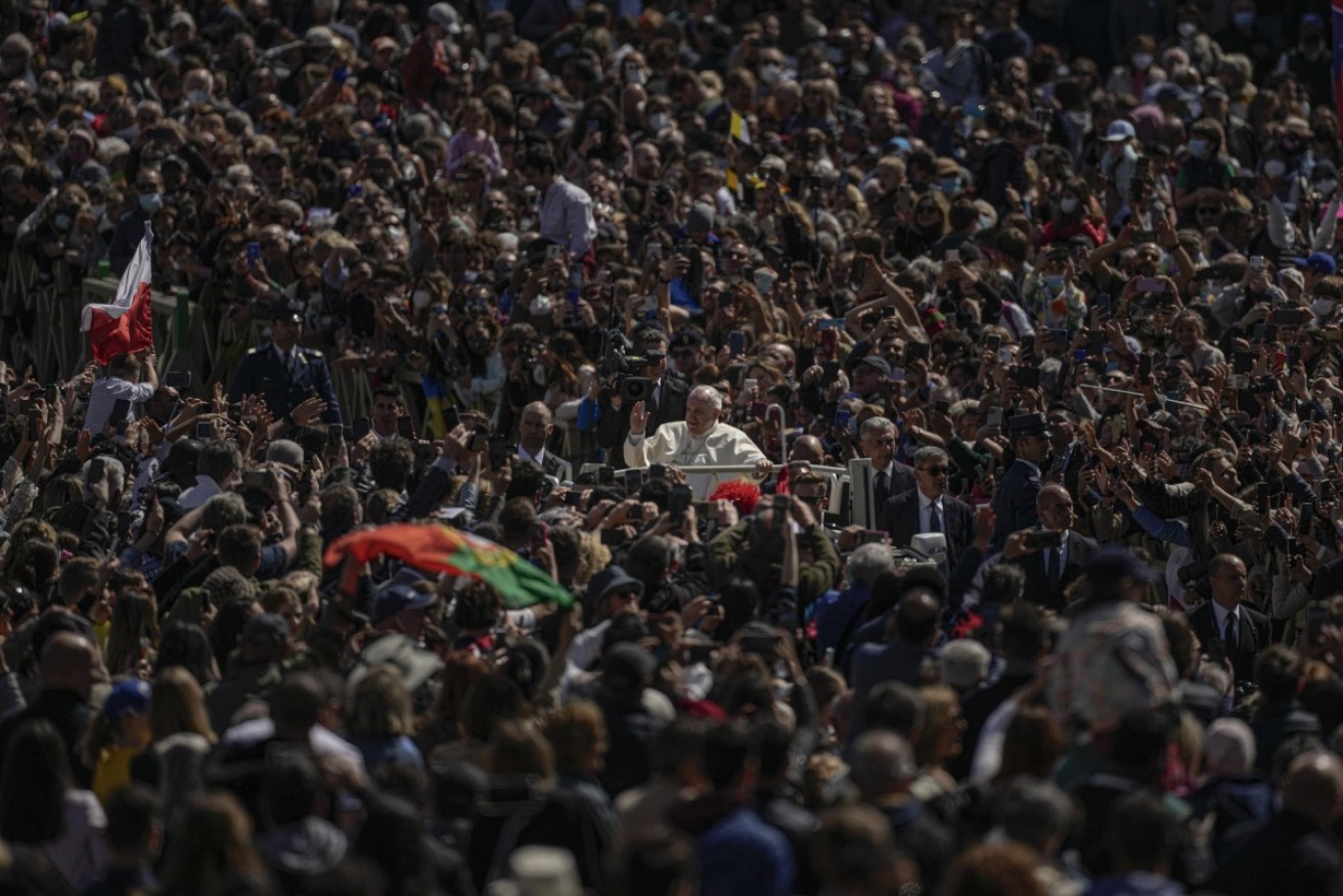 Pope Francis drives through the crowd at the end of the Easter Sunday mass in St Peter's Square.