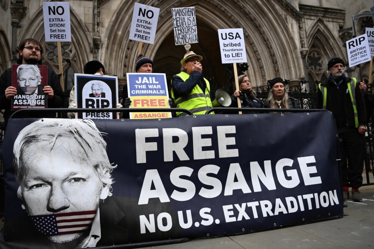 Supporters of Julian Assange gather outside court in London.
