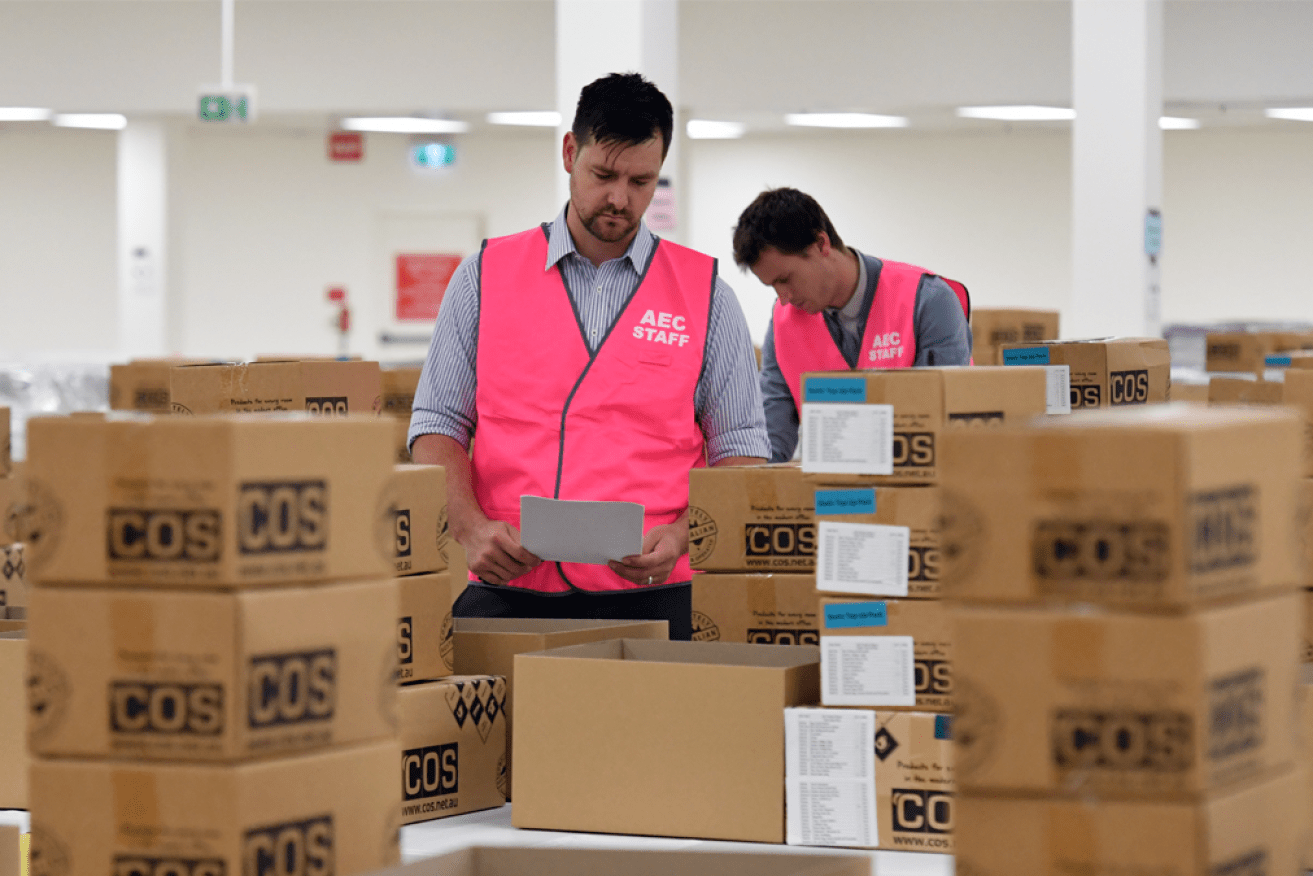 The AEC's Evan Ekin-Smyth inspects voting materials at a warehouse in Queanbeyan, near Canberra.