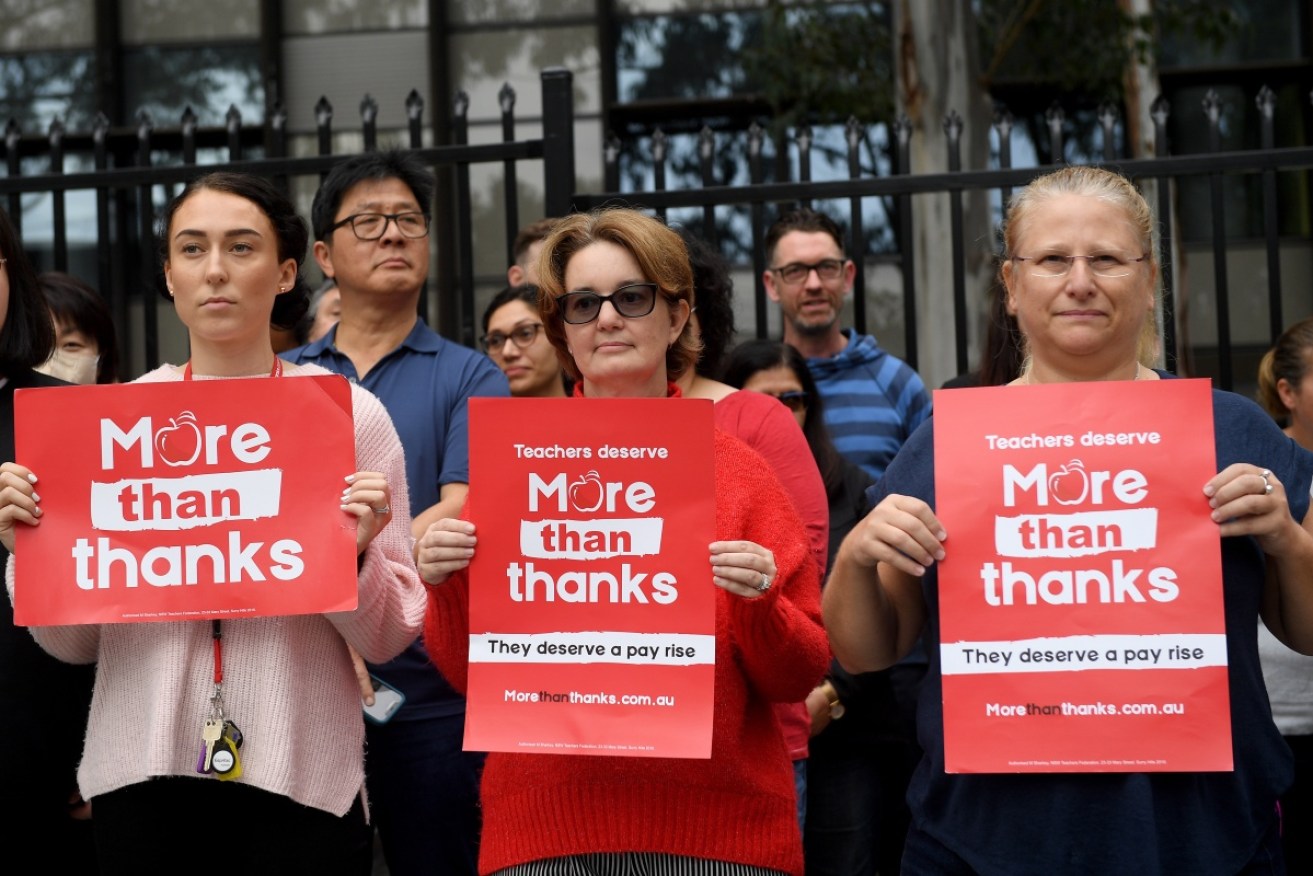 Teachers walked out of a Sydney school as the premier arrived in defiance of a union ban. 