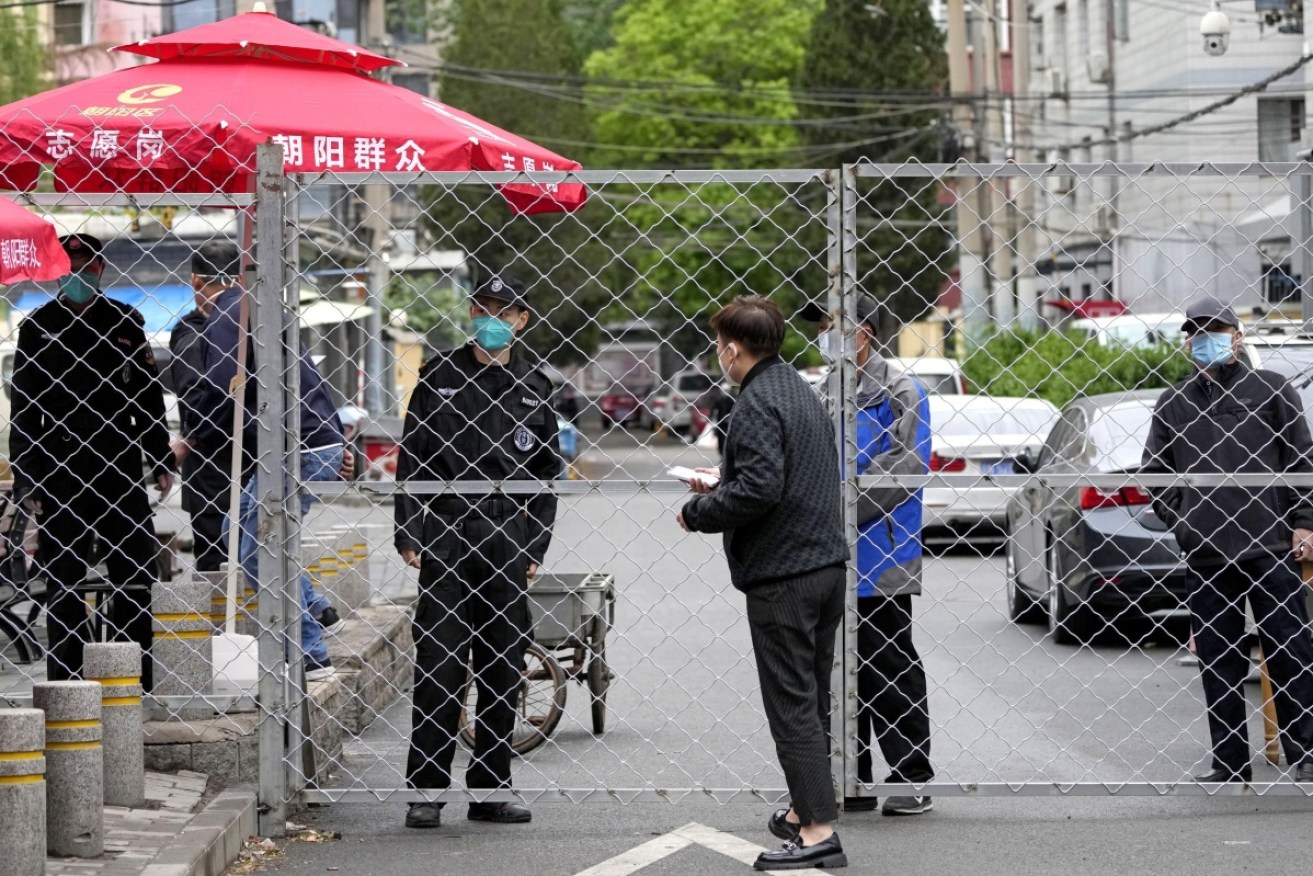 Fences are starting to go up in residential areas as Beijing reacts to growing COVID-19 cases.