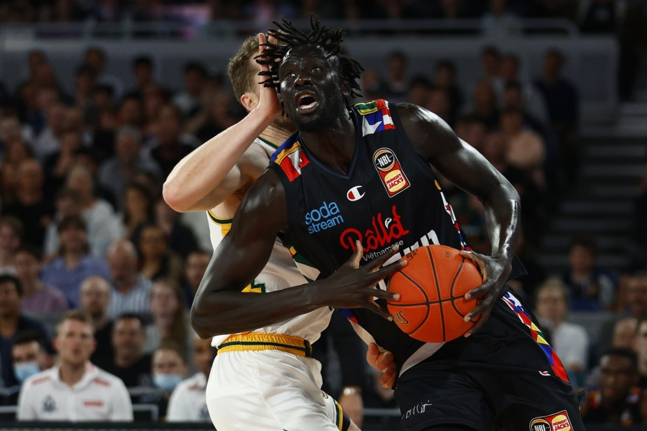 Jo Lual-Acuil drives to the basket under pressure from Jarred Bairstow of the JackJumpers on Thursday night.