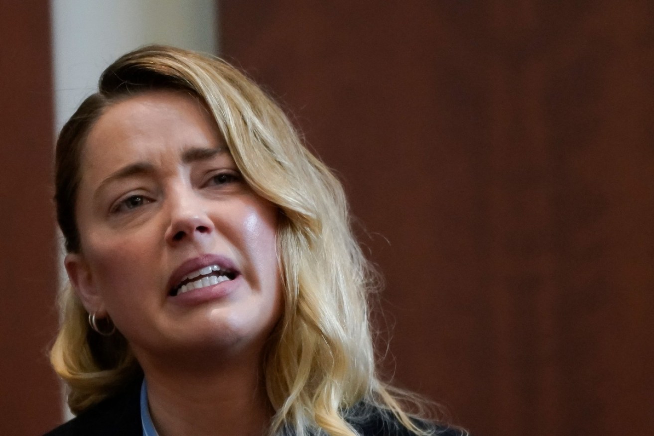 Amber Heard has become emotional giving evidence in her defamation trial against Johnny Depp.